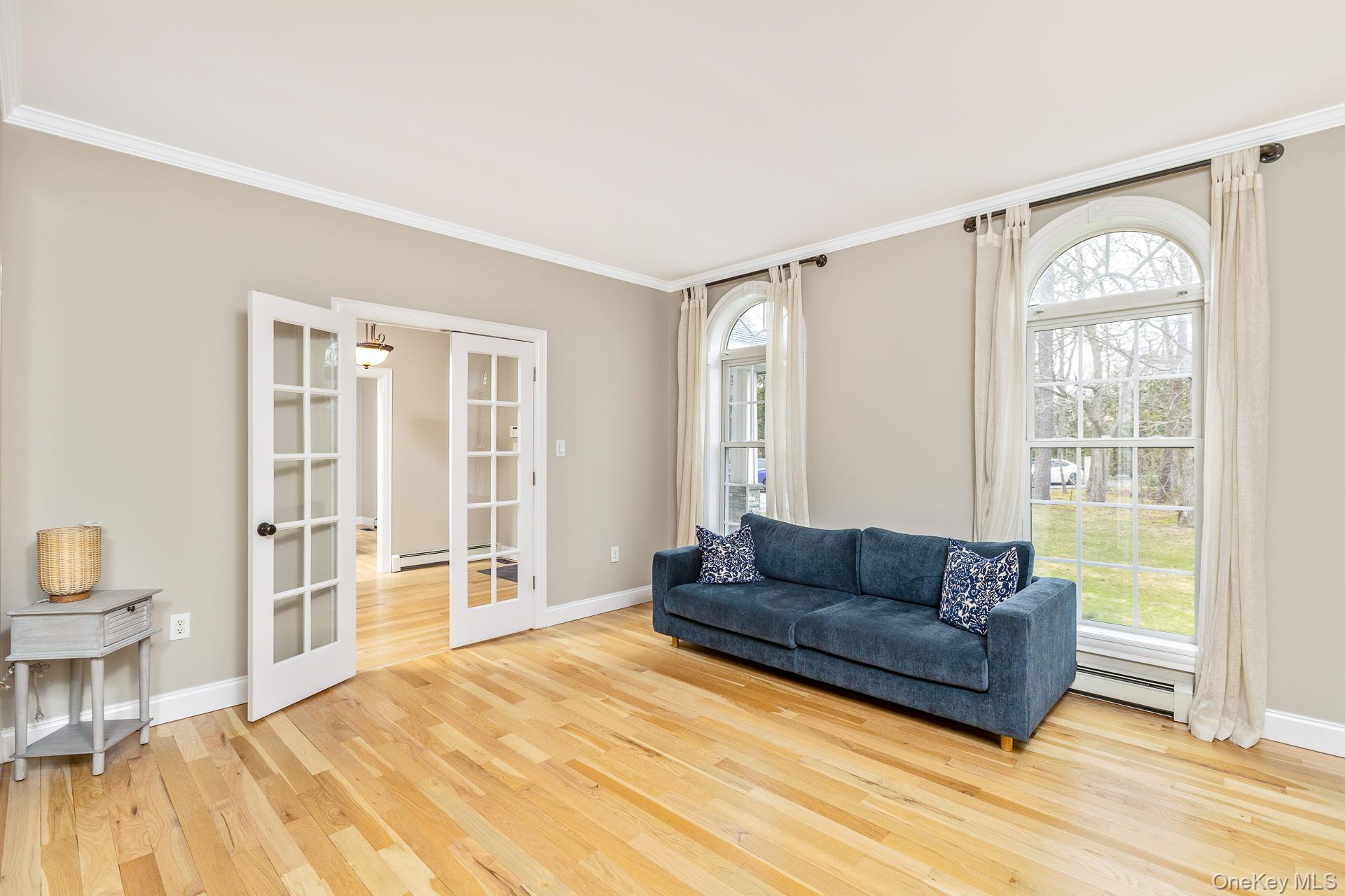 26 Box Tree Road East Quogue, NY 11942 - Photo 24 of 49 a living room with furniture and a window