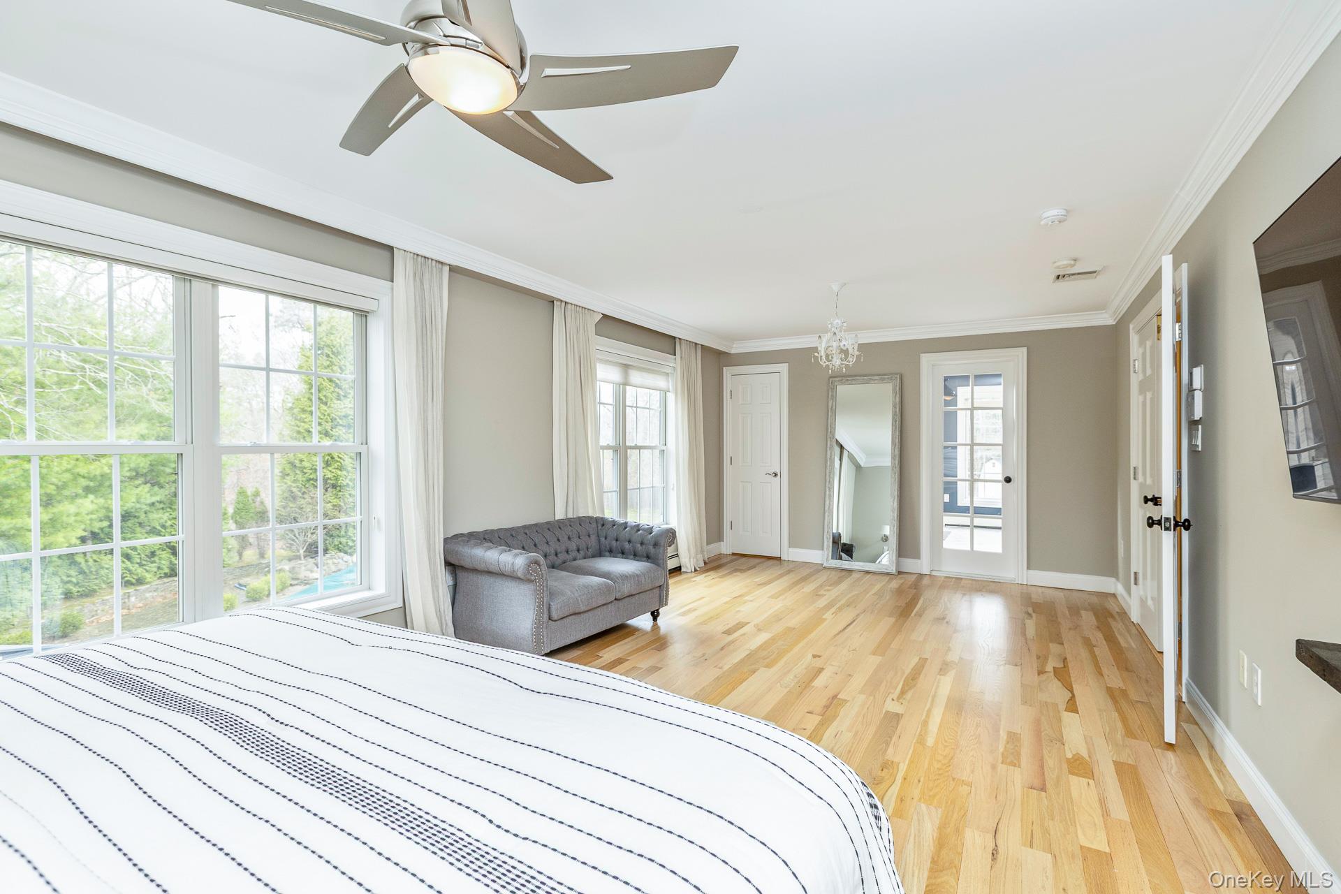 26 Box Tree Road East Quogue, NY 11942 - Photo 27 of 49 a bedroom with a large bed and a window