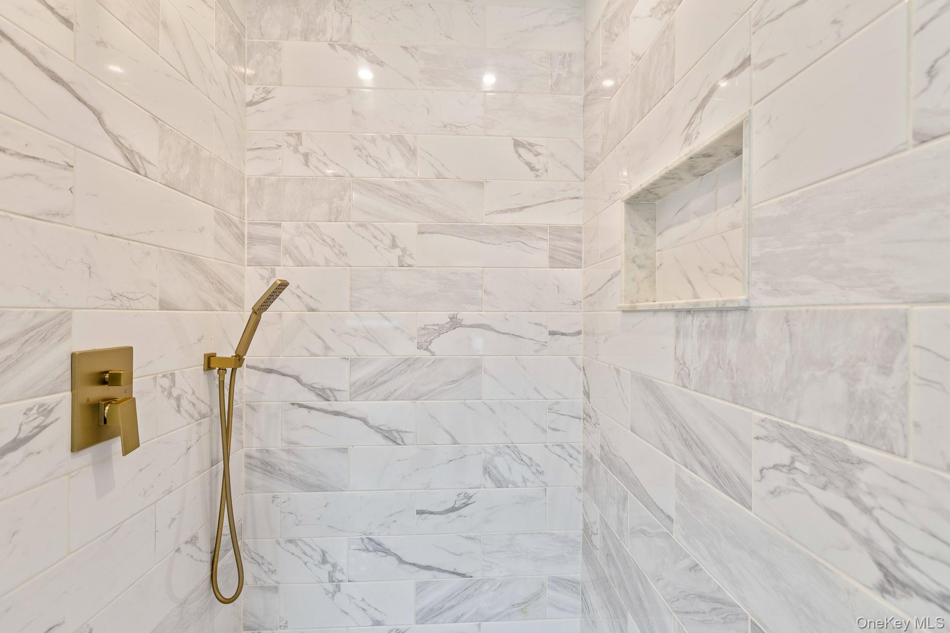 26 Box Tree Road East Quogue, NY 11942 - Photo 31 of 49 a bathroom with a shower