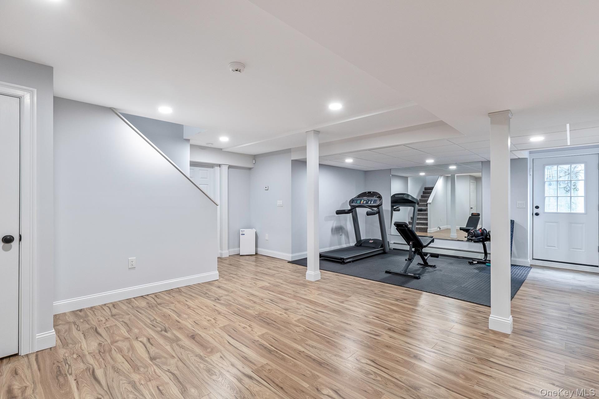 26 Box Tree Road East Quogue, NY 11942 - Photo 42 of 49 a view of a room with gym equipment and a table