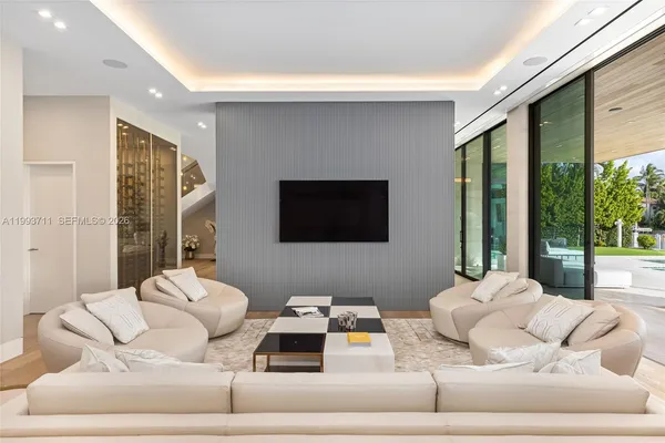a bedroom with a large bed and a couch