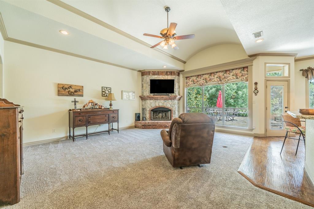 109 Overton Ridge Circle Weatherford, TX 76088 - Photo 4 of 27 Stone and brick wood burning fireplace.
