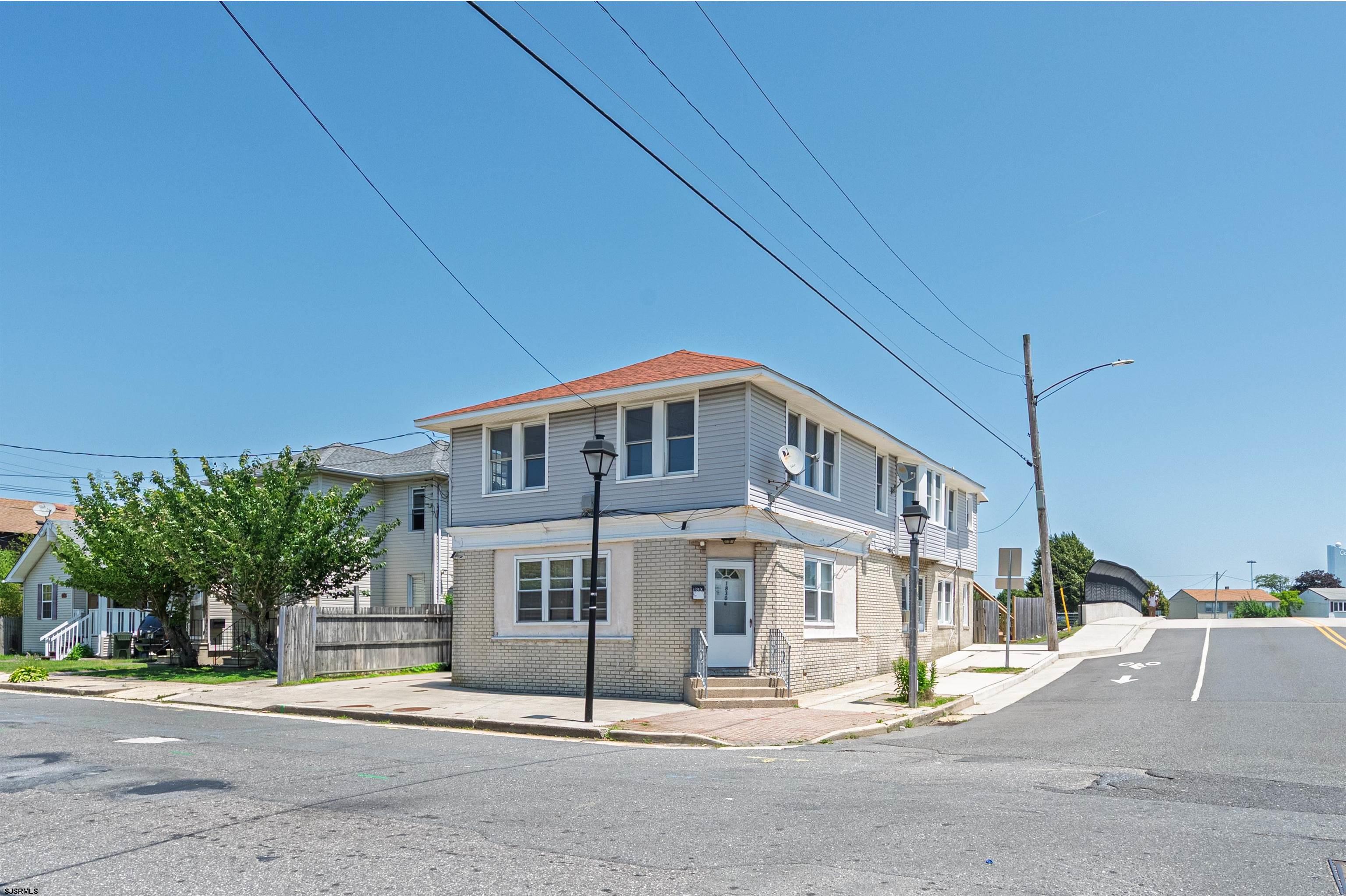 1830 East Riverside Drive Atlantic City, NJ 08401 - Photo 1 of 1 a front view of a house with a garden