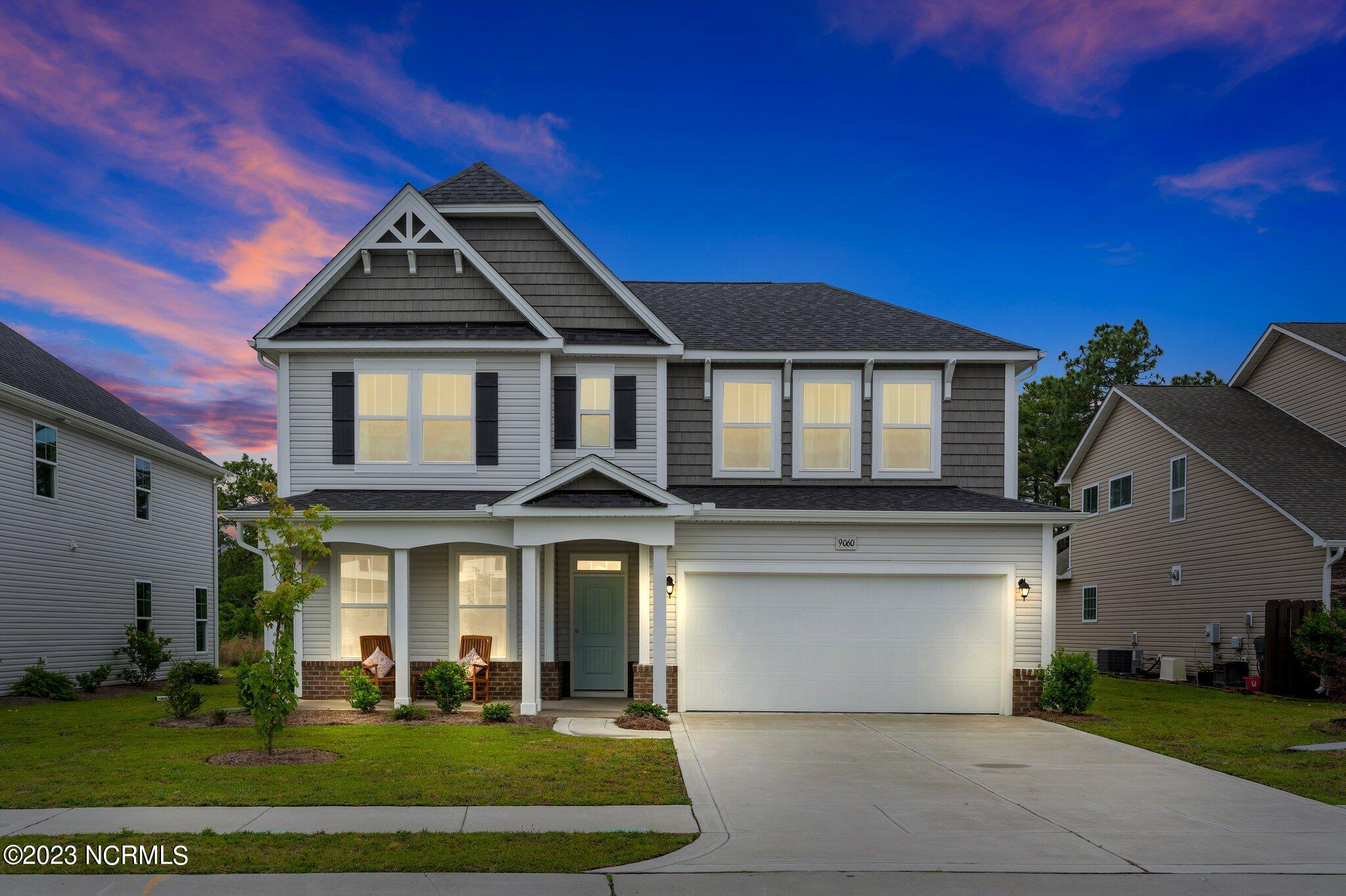 9060 Gardens Grove Road Leland, NC 28451 - Photo 2 of 28 EXTERIOR FRONT TWILIGHT