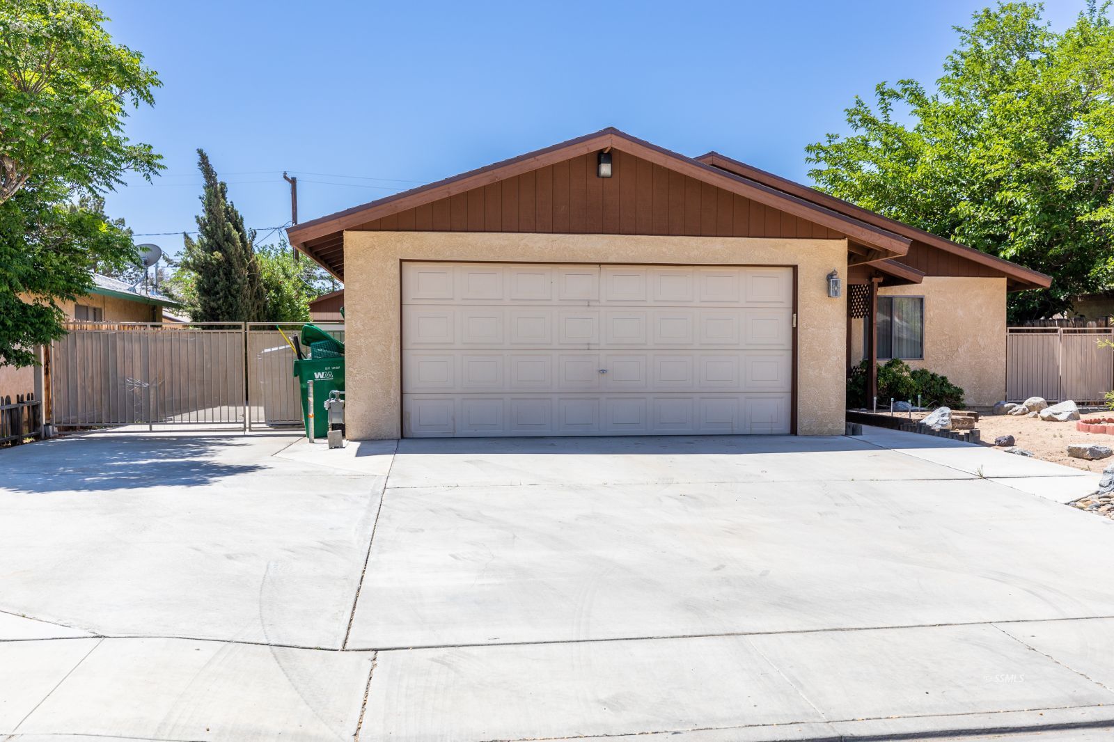 813 West Perdew Avenue Ridgecrest, CA 93555 - Photo 4 of 28 a front view of a house with a yard and garage