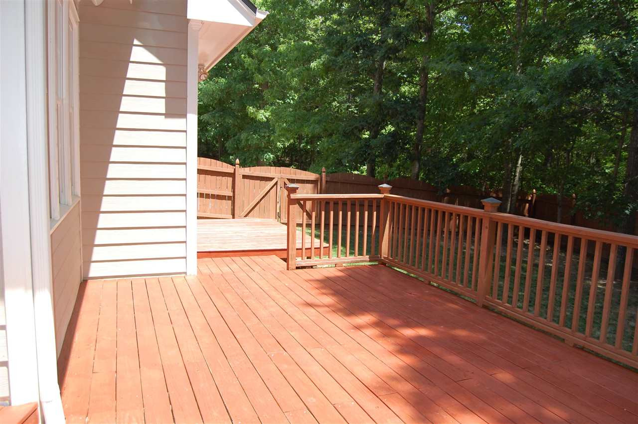 840 Nowell Ridge Road Raleigh, NC 27607 - Photo 23 of 25 View across all three decks, privacy fence is scalloped, stained & has gates on both sides of the house! deck
