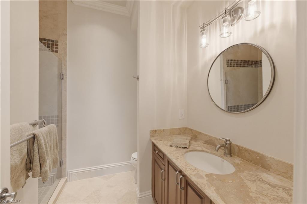 361 Pirates Bight Naples, FL 34103 - Photo 25 of 45 a bathroom with a granite countertop sink and a mirror