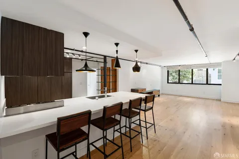 a view of a dining room with furniture and window