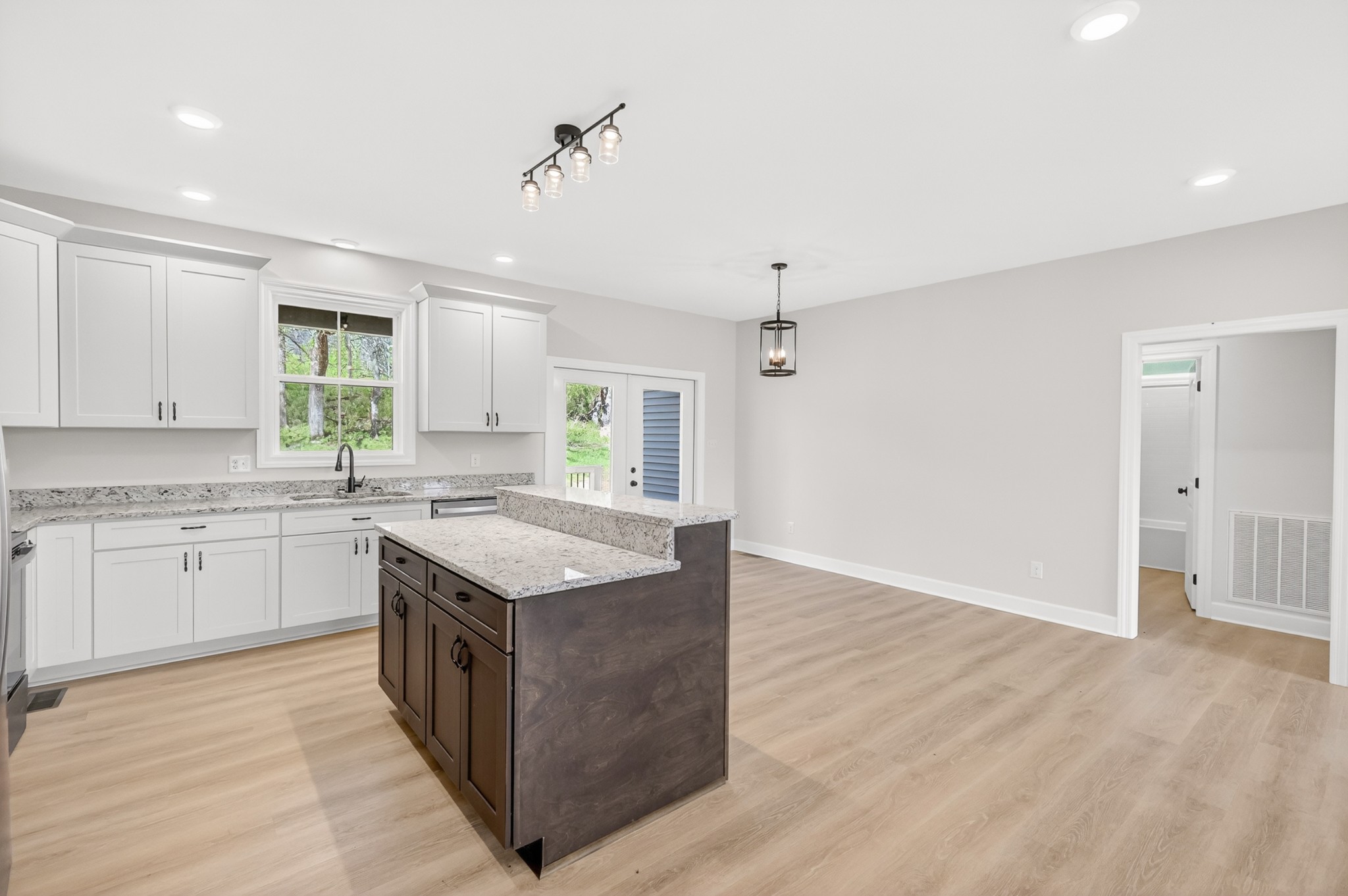 8415 West Sheepneck Road Mount Pleasant, TN 38474 - Photo 15 of 40 a kitchen with a stove window and cabinets