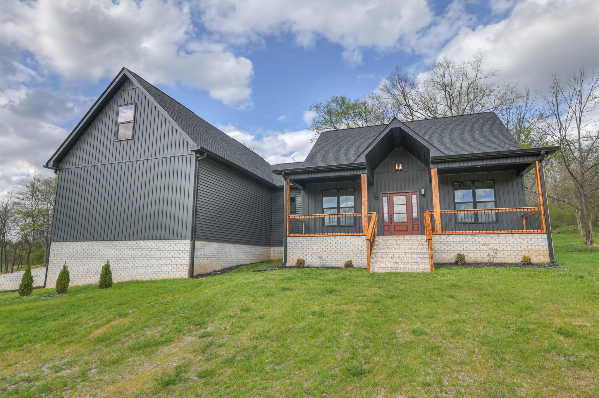 8415 West Sheepneck Road Mount Pleasant, TN 38474 - Photo 8 of 40 a front view of a house with a yard