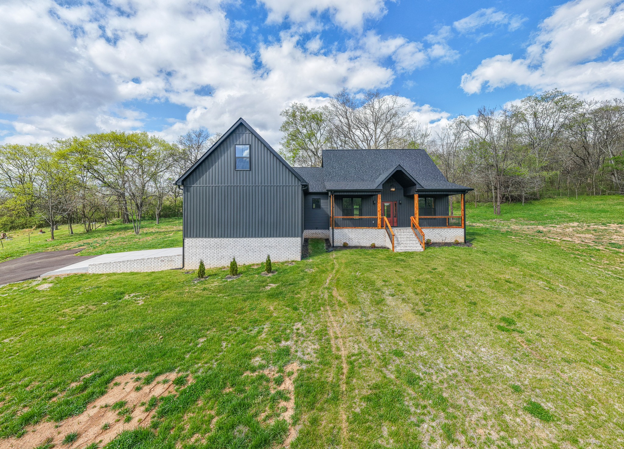 8415 West Sheepneck Road Mount Pleasant, TN 38474 - Photo 9 of 40 a front view of a house with garden