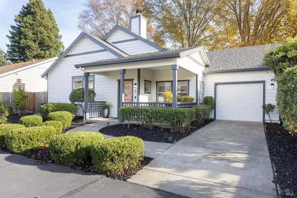 a view of a house with garden and plants
