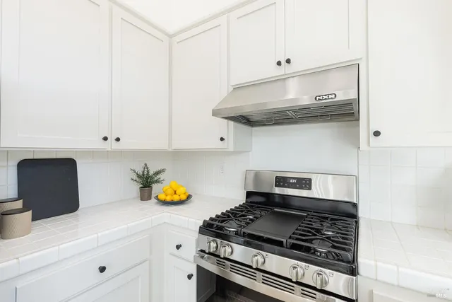 a kitchen with a sink and cabinets