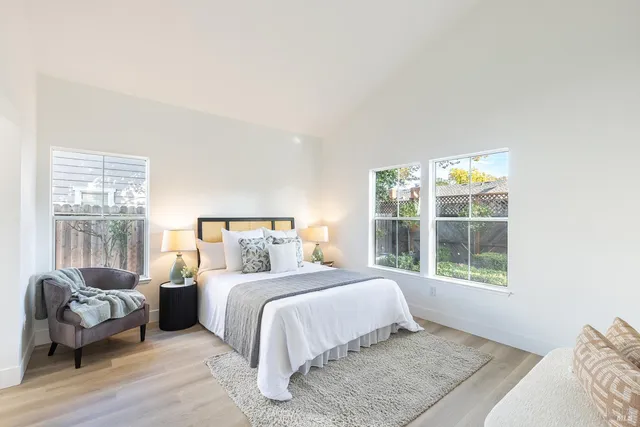 a bedroom with a bed and a couch