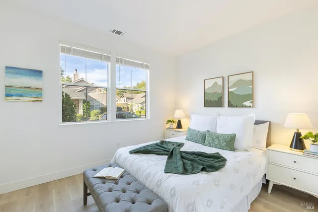 a bed room with a bed and a window