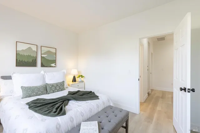 a bedroom with a bed and couch