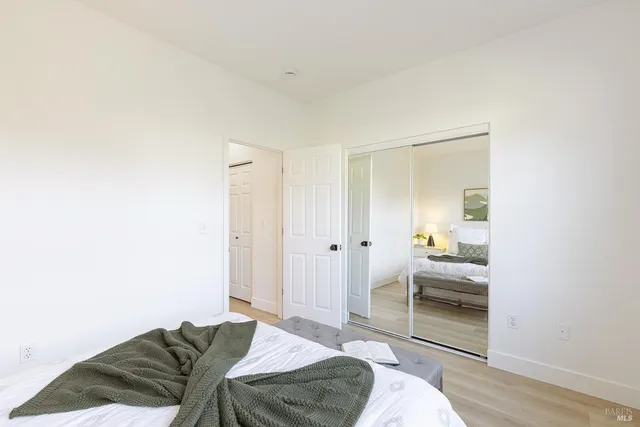 a bedroom with a bed and a cabinets