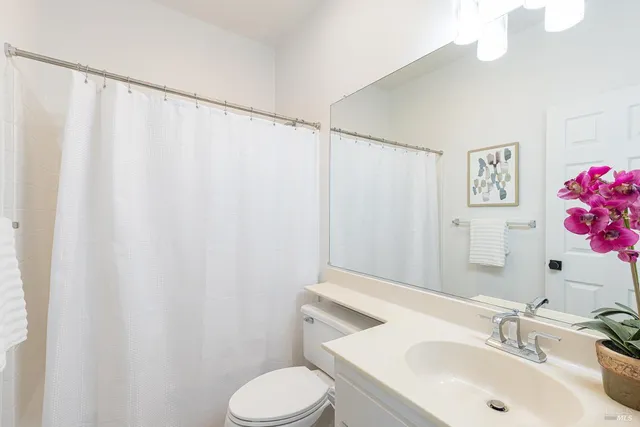 a bathroom with a sink and toilet