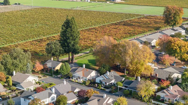 a view of a patio with chairs under an umbrella