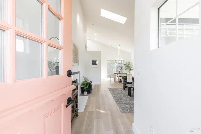 a dining room with furniture and a window