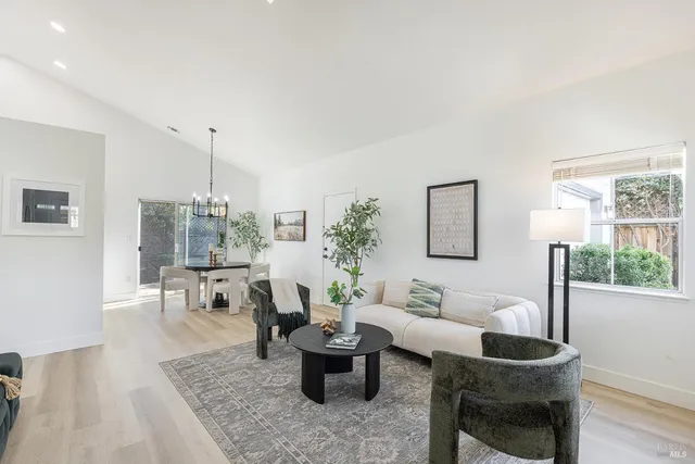 a living room with furniture and a table