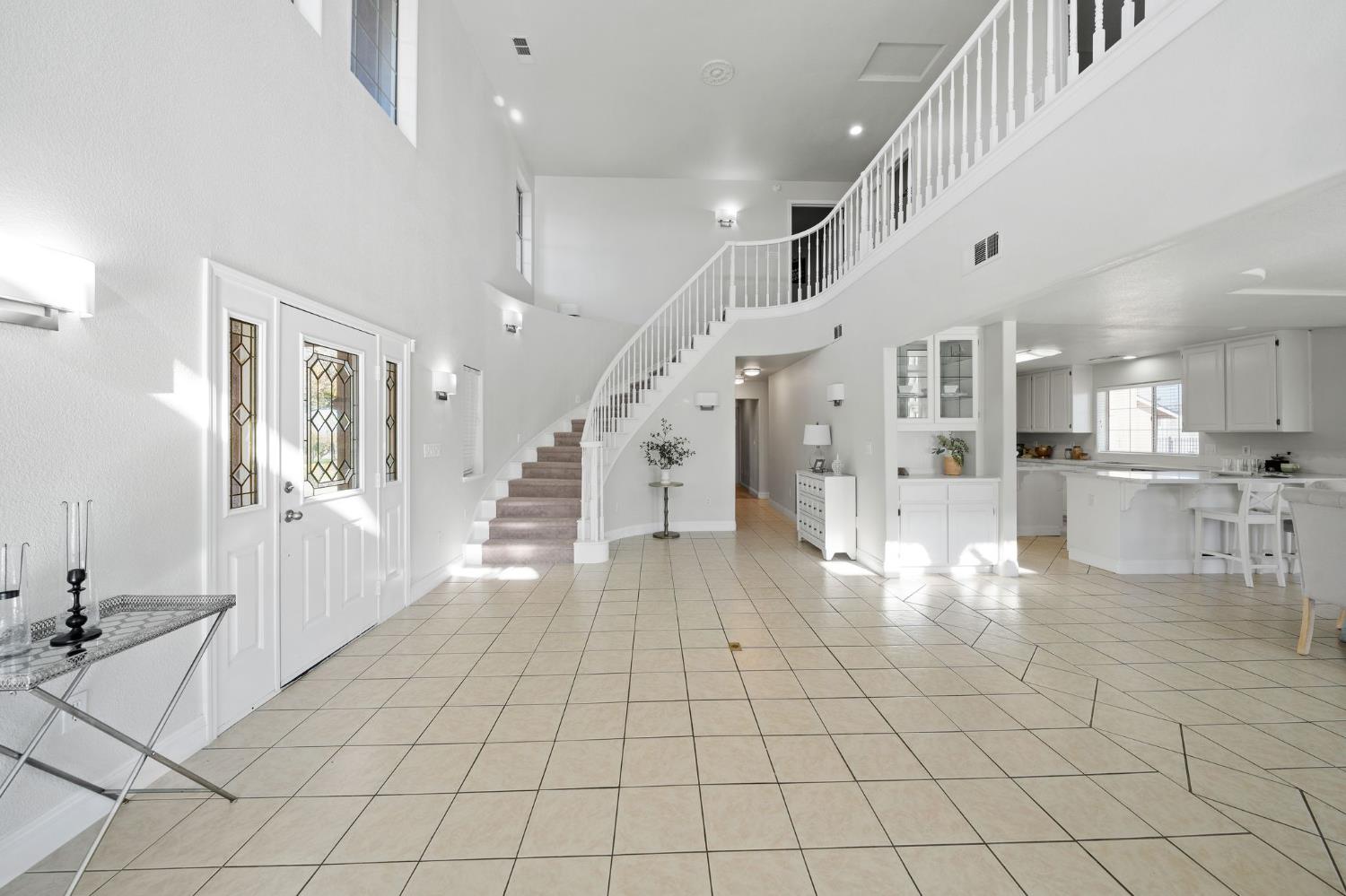 6312 Skittone Road Modesto, CA 95356 - Photo 12 of 93 a view of entryway with kitchen and dining area