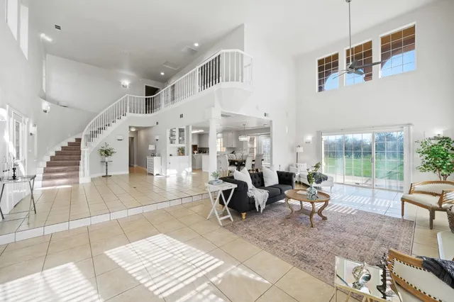 a kitchen with a sink a stove and cabinets
