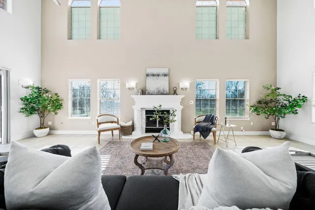a spacious bathroom with a double vanity sink mirror and toilet