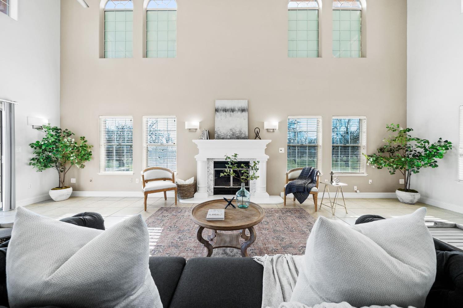 6312 Skittone Road Modesto, CA 95356 - Photo 17 of 93 a living room with furniture potted plant and a large window