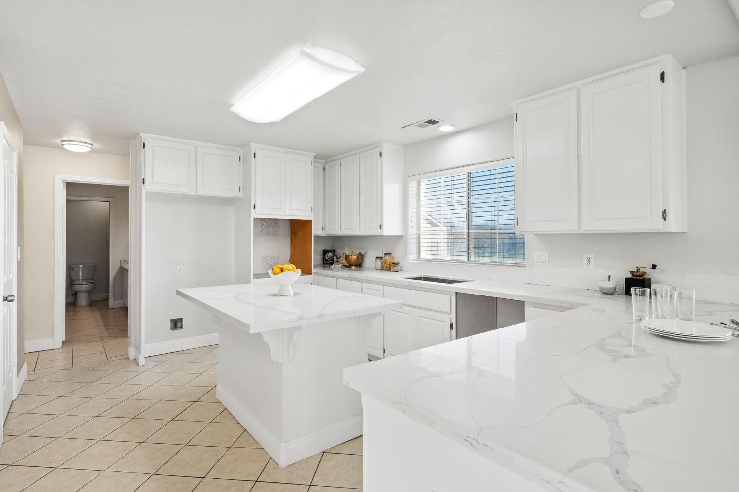 6312 Skittone Road Modesto, CA 95356 - Photo 23 of 93 a kitchen that has a sink and a stove