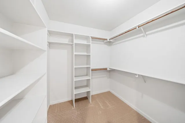 a view of a livingroom with furniture and a potted plant