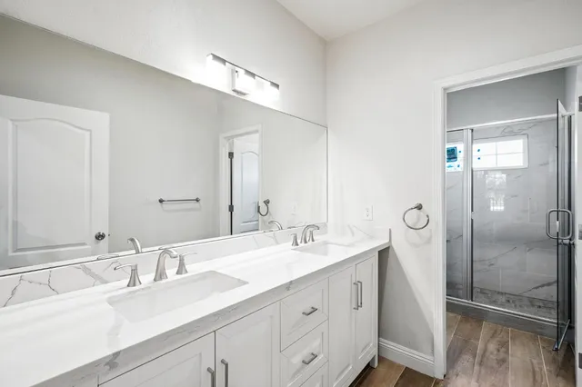 a white bath tub sitting in a bathroom next to a window