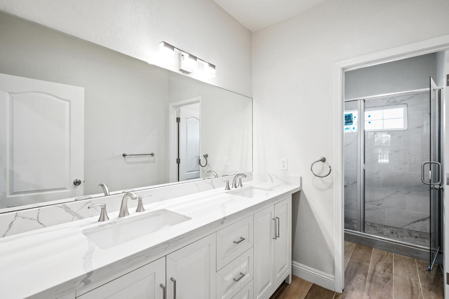6312 Skittone Road Modesto, CA 95356 - Photo 34 of 93 a bathroom with a double vanity sink mirror and double