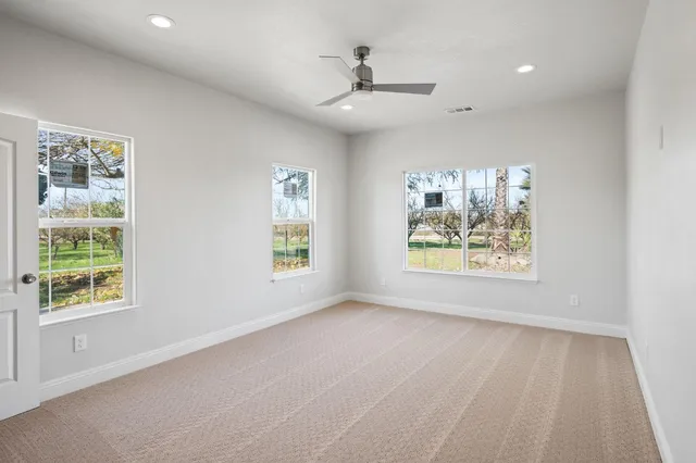a view of a hallway with wooden shelves