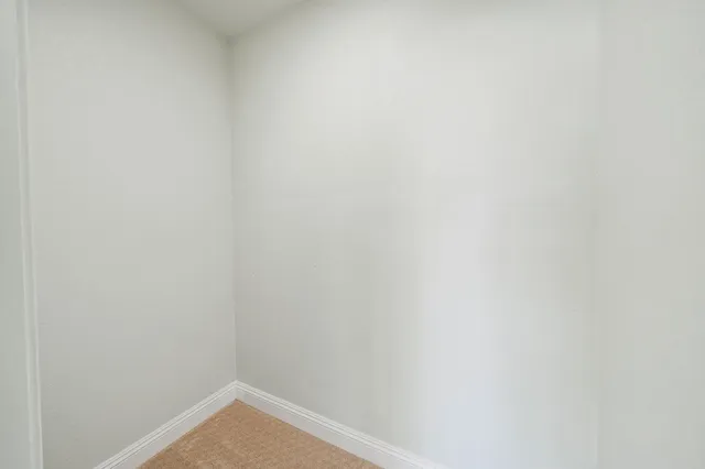 a bathroom with a sink mirror and shower