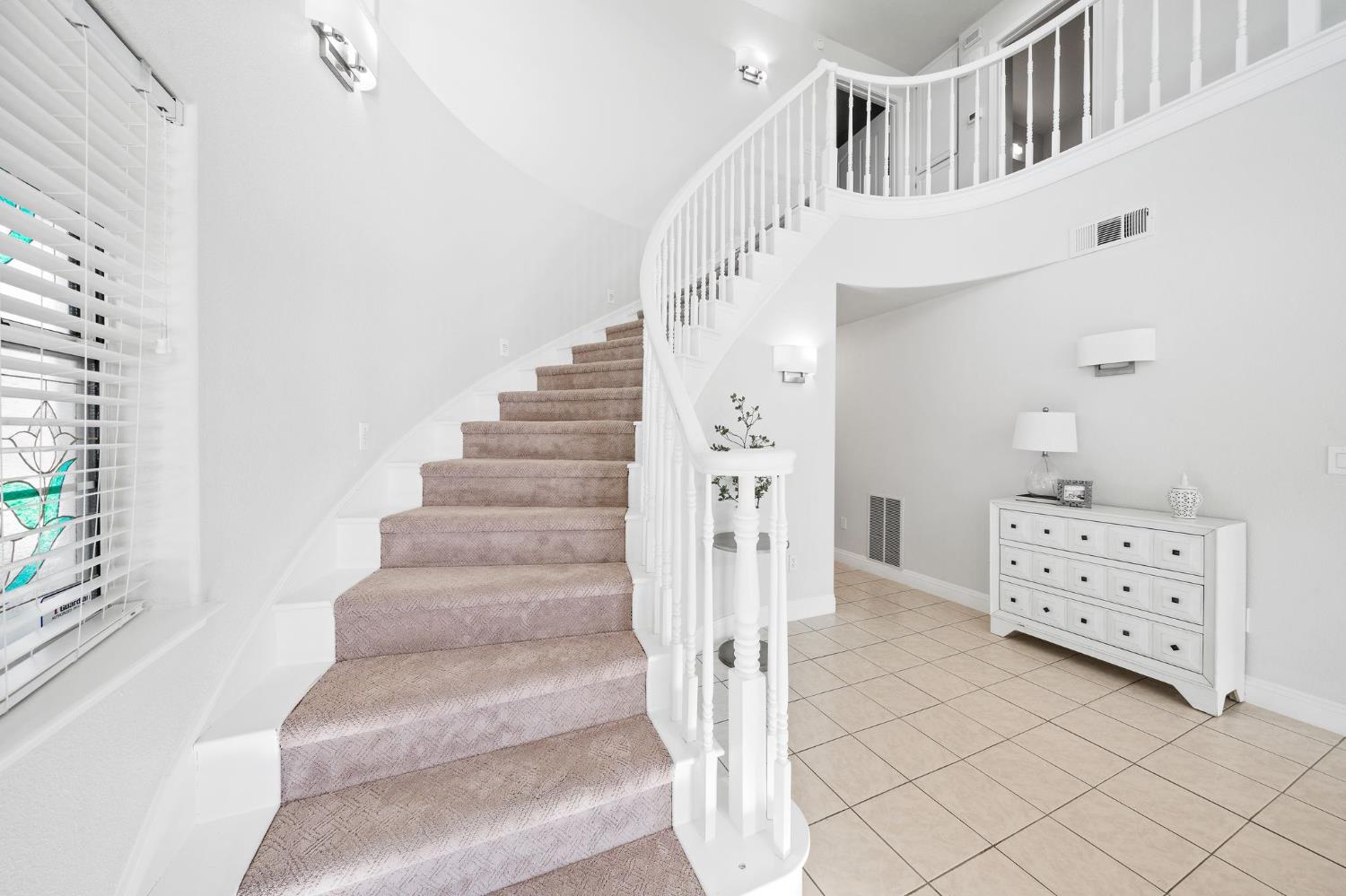 6312 Skittone Road Modesto, CA 95356 - Photo 40 of 93 a view of staircase with white walls and windows