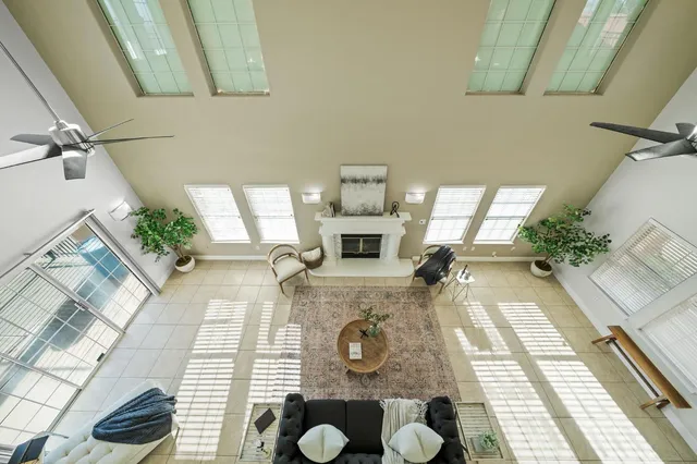 a view of a house with a yard and tree s