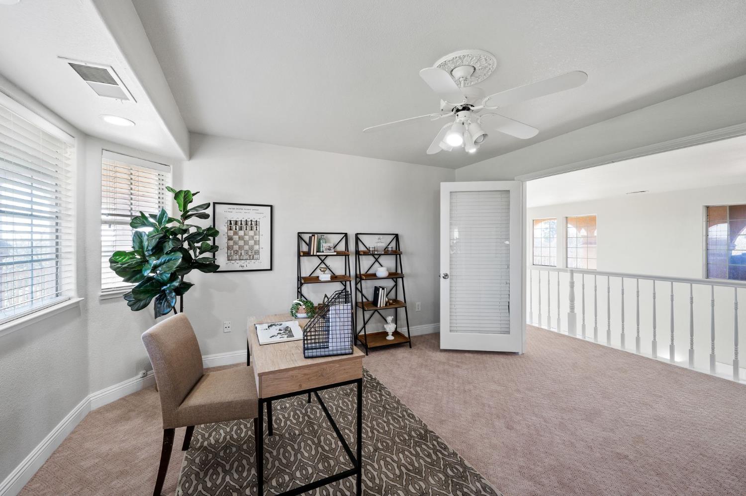 6312 Skittone Road Modesto, CA 95356 - Photo 45 of 93 a view of a livingroom with furniture and a potted plant