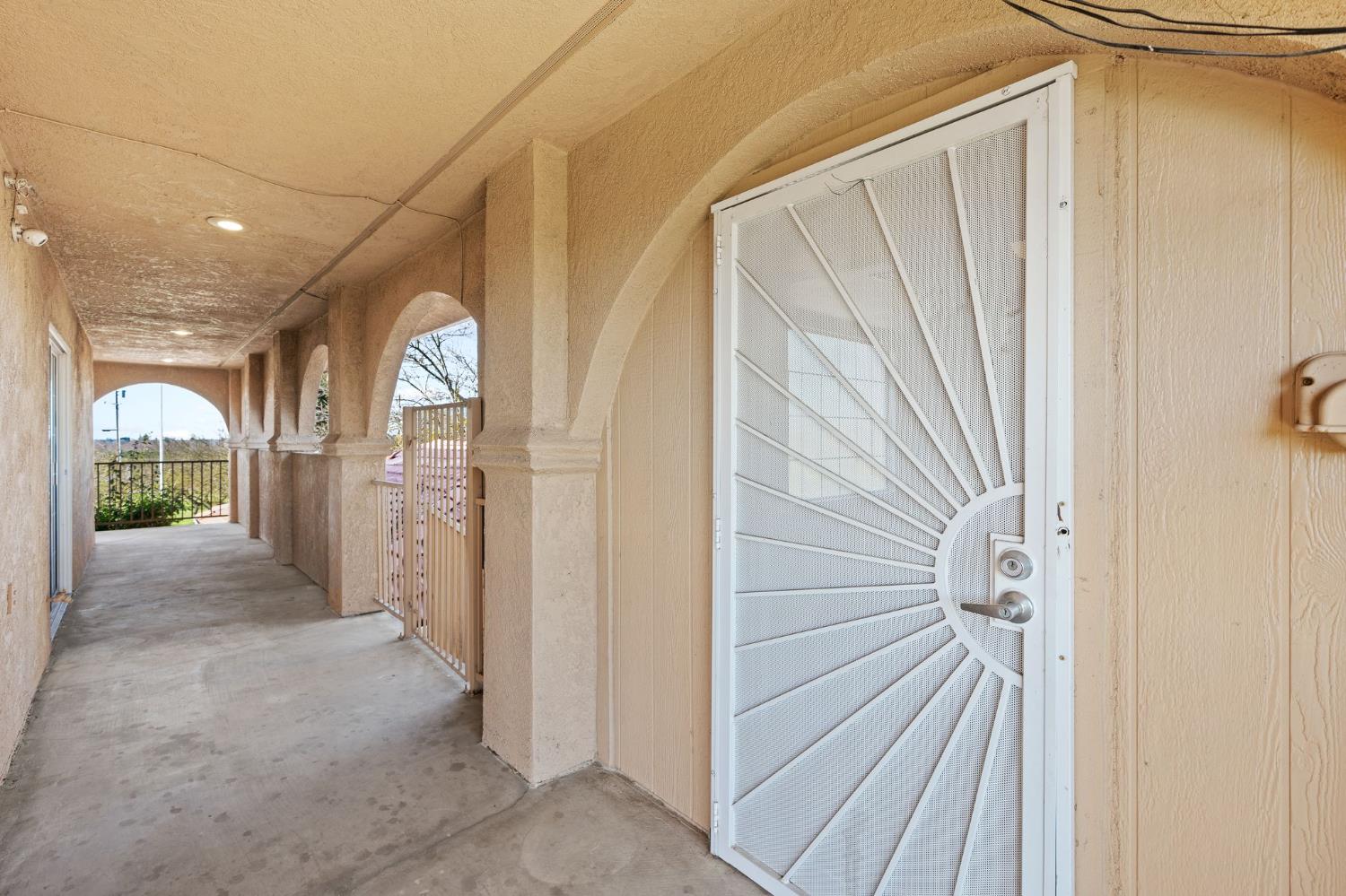 6312 Skittone Road Modesto, CA 95356 - Photo 63 of 93 a view of a hallway with wooden shelves