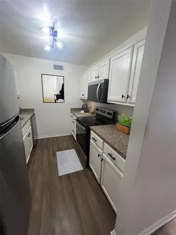 a view of a kitchen from the kitchen