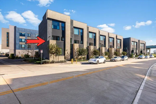 a view of a building with traffic signal lights