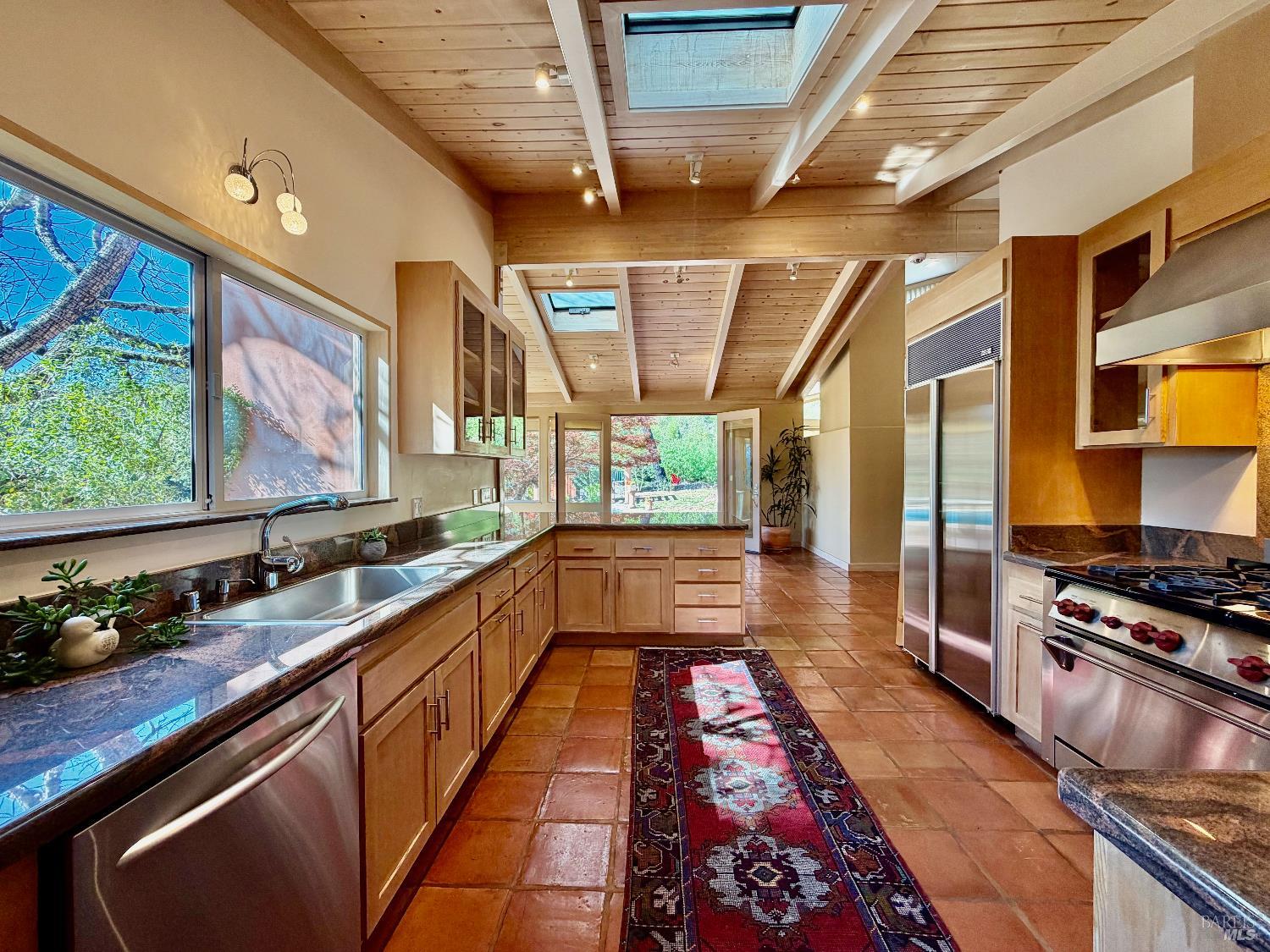 321 Dutch Henry Canyon Road Calistoga, CA 94515 - Photo 13 of 50 a large kitchen with stainless steel appliances granite countertop a stove and a sink