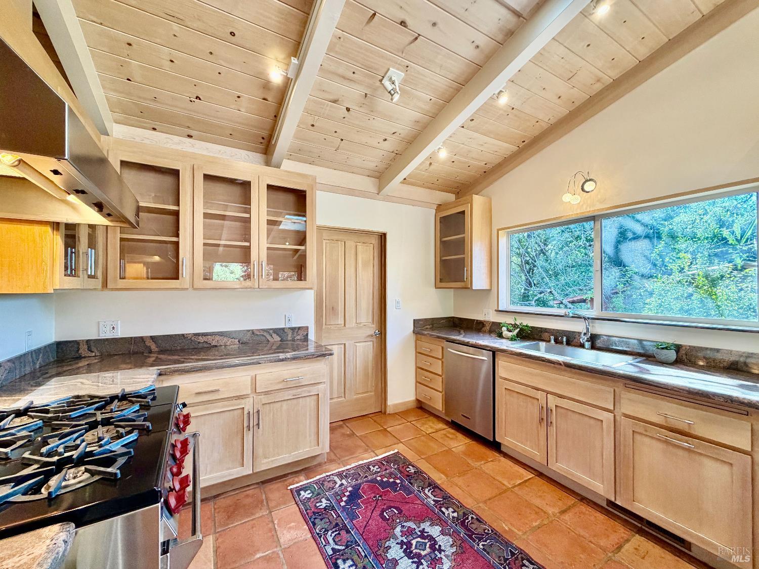321 Dutch Henry Canyon Road Calistoga, CA 94515 - Photo 15 of 50 a kitchen with stainless steel appliances granite countertop a stove and a sink