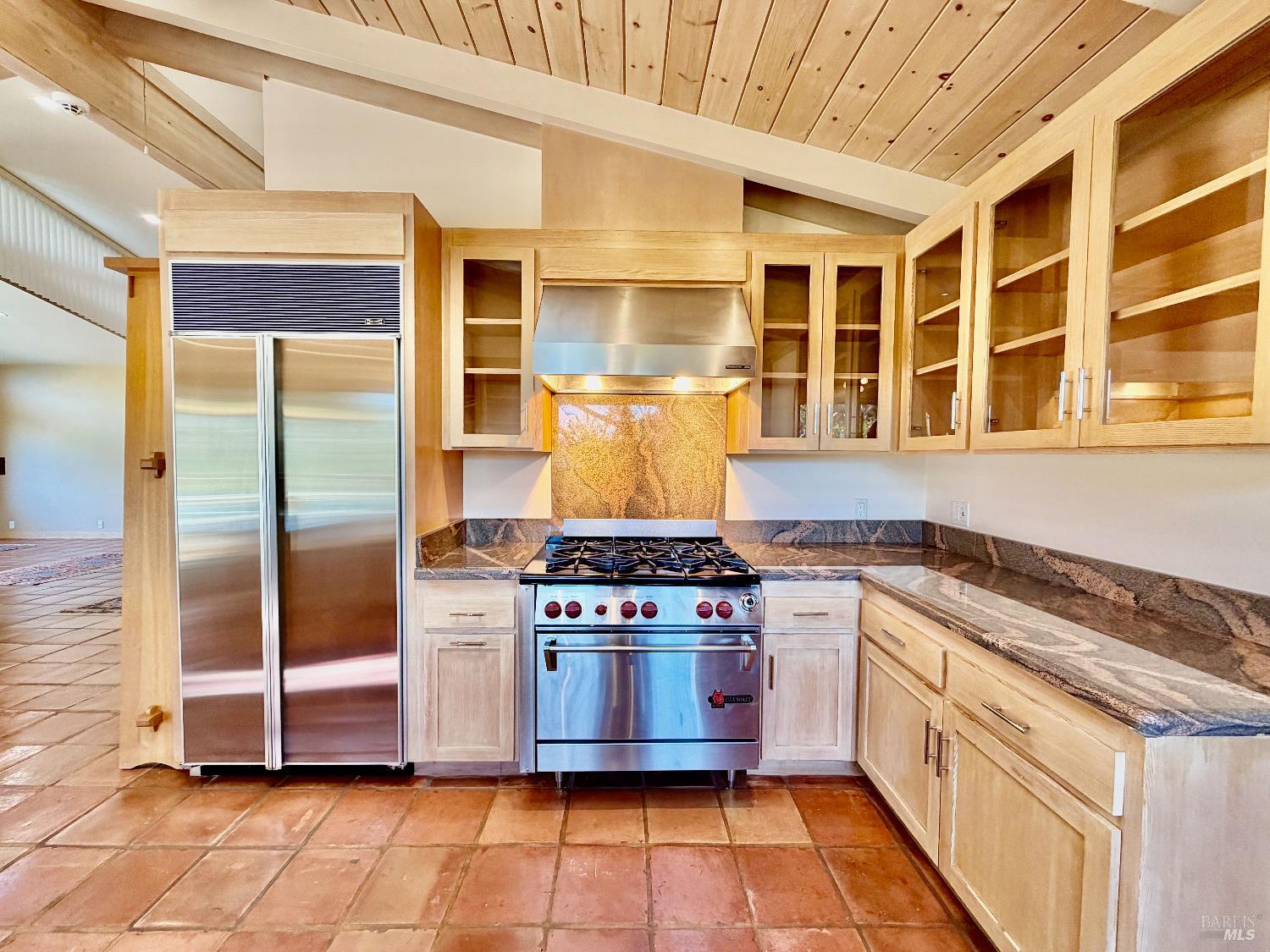 321 Dutch Henry Canyon Road Calistoga, CA 94515 - Photo 17 of 50 a kitchen with stainless steel appliances granite countertop a stove and a refrigerator