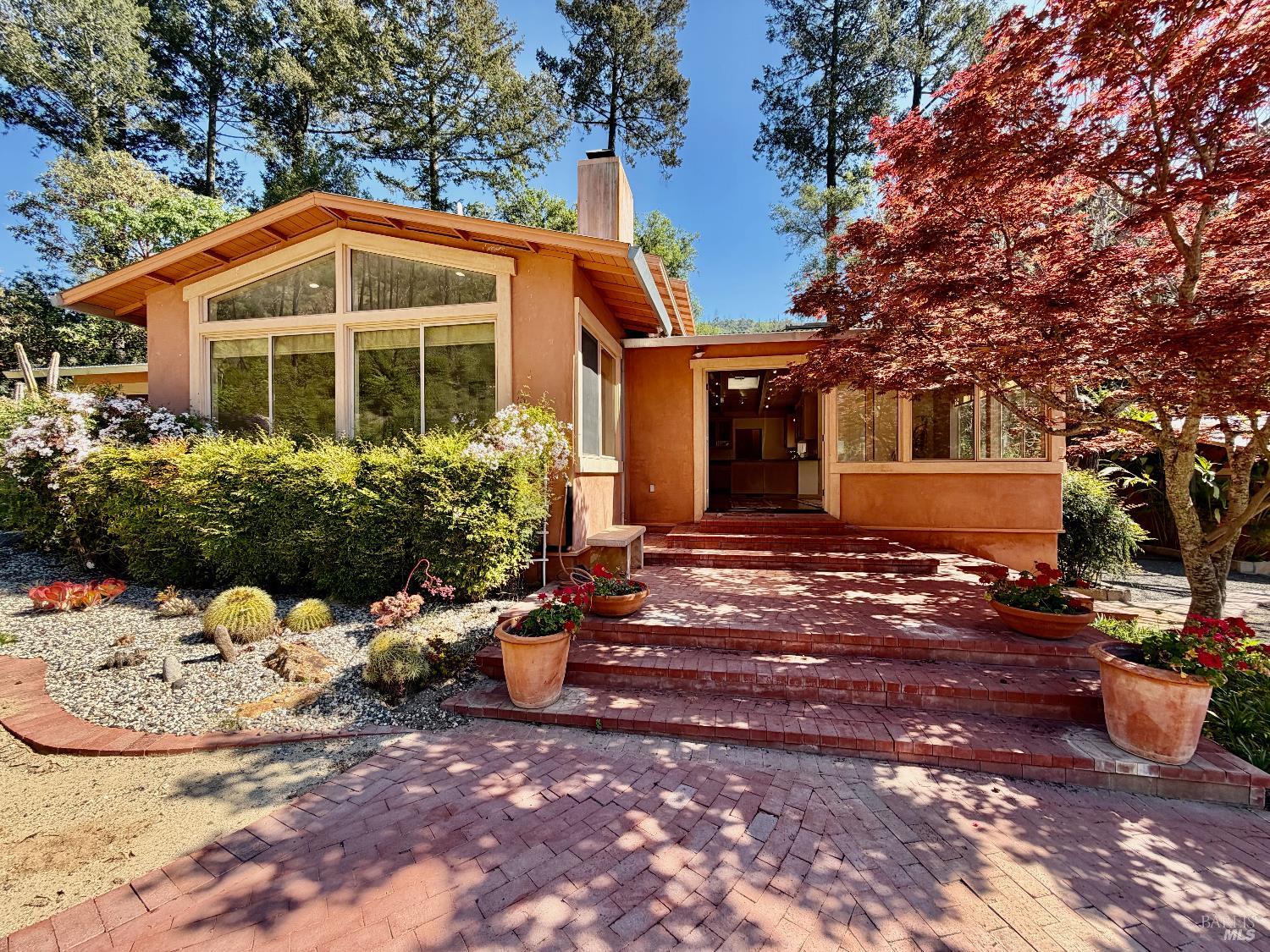 321 Dutch Henry Canyon Road Calistoga, CA 94515 - Photo 2 of 50 a front view of a house with a yard