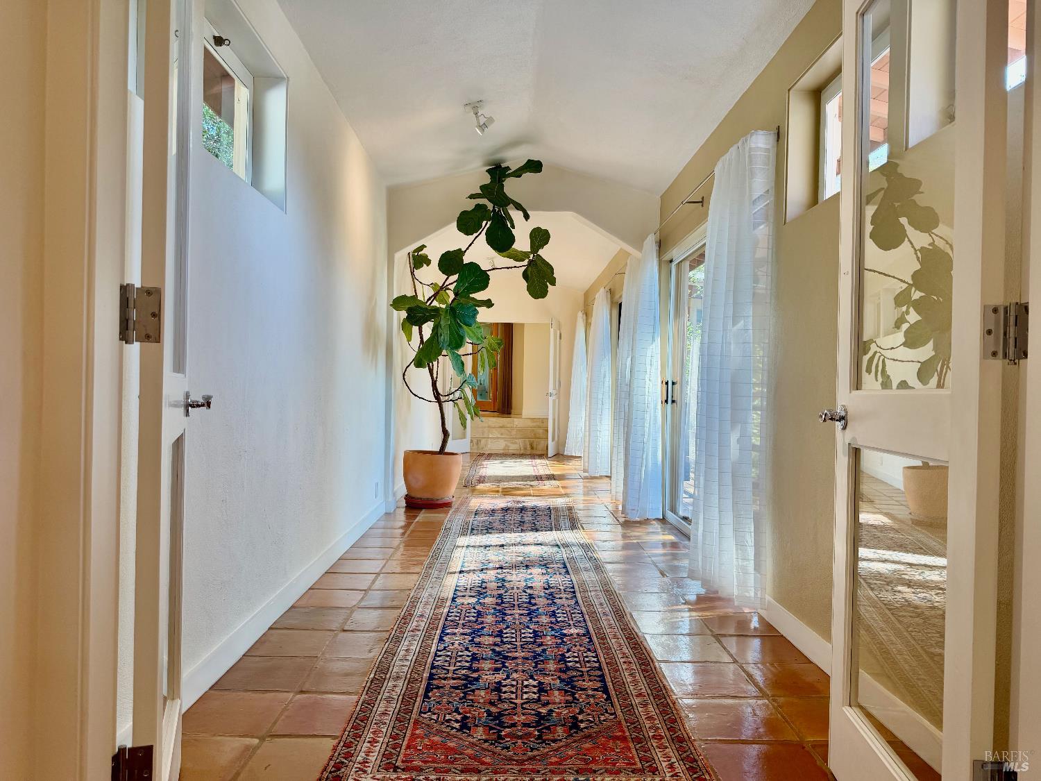 321 Dutch Henry Canyon Road Calistoga, CA 94515 - Photo 21 of 50 a hallway view with wooden floor and a chandelier