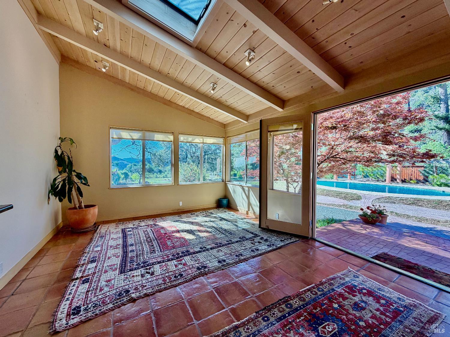 321 Dutch Henry Canyon Road Calistoga, CA 94515 - Photo 3 of 50 a bed sitting in a bedroom next to a window