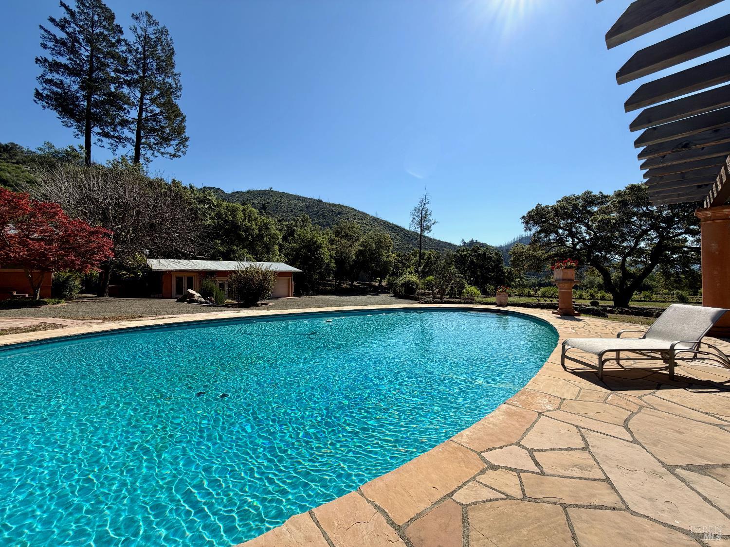 321 Dutch Henry Canyon Road Calistoga, CA 94515 - Photo 40 of 50 a view of a swimming pool and lounge chair