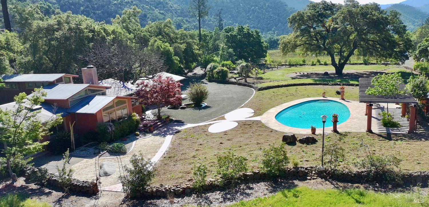 321 Dutch Henry Canyon Road Calistoga, CA 94515 - Photo 45 of 50 a swimming pool with outdoor seating and yard