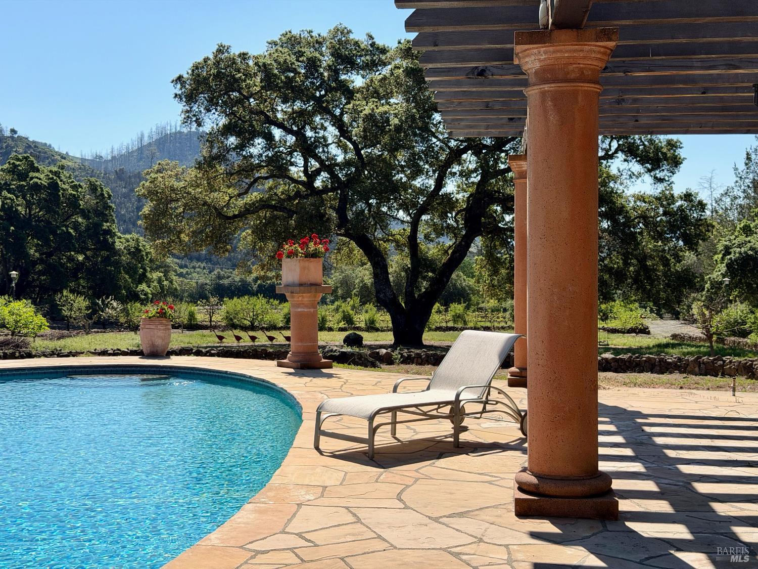321 Dutch Henry Canyon Road Calistoga, CA 94515 - Photo 50 of 50 a view of a patio with a table and chairs
